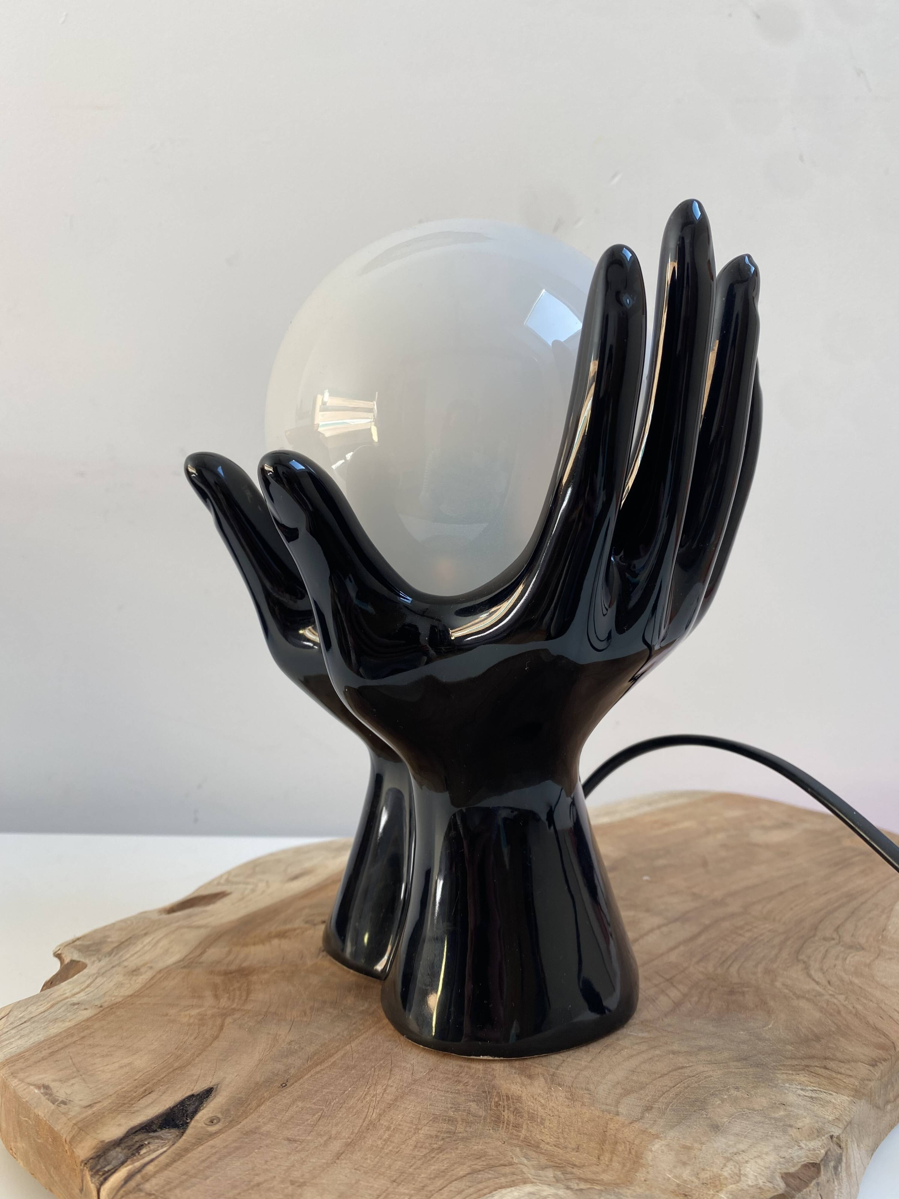 Sculpted ceramic globe lamp.