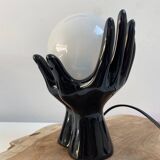 Sculpted ceramic globe lamp.