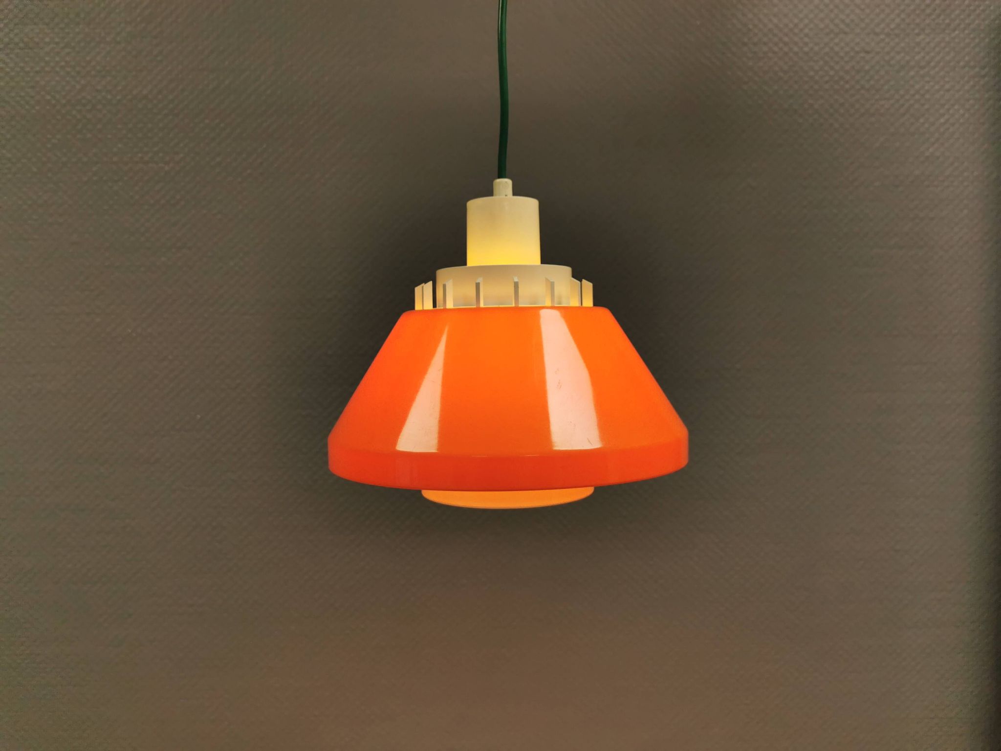 An orange pendant lamp made from hard-pressed ABS plastic. Denmark 1970s