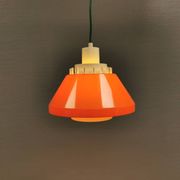 An orange pendant lamp made from hard-pressed ABS plastic. Denmark 1970s