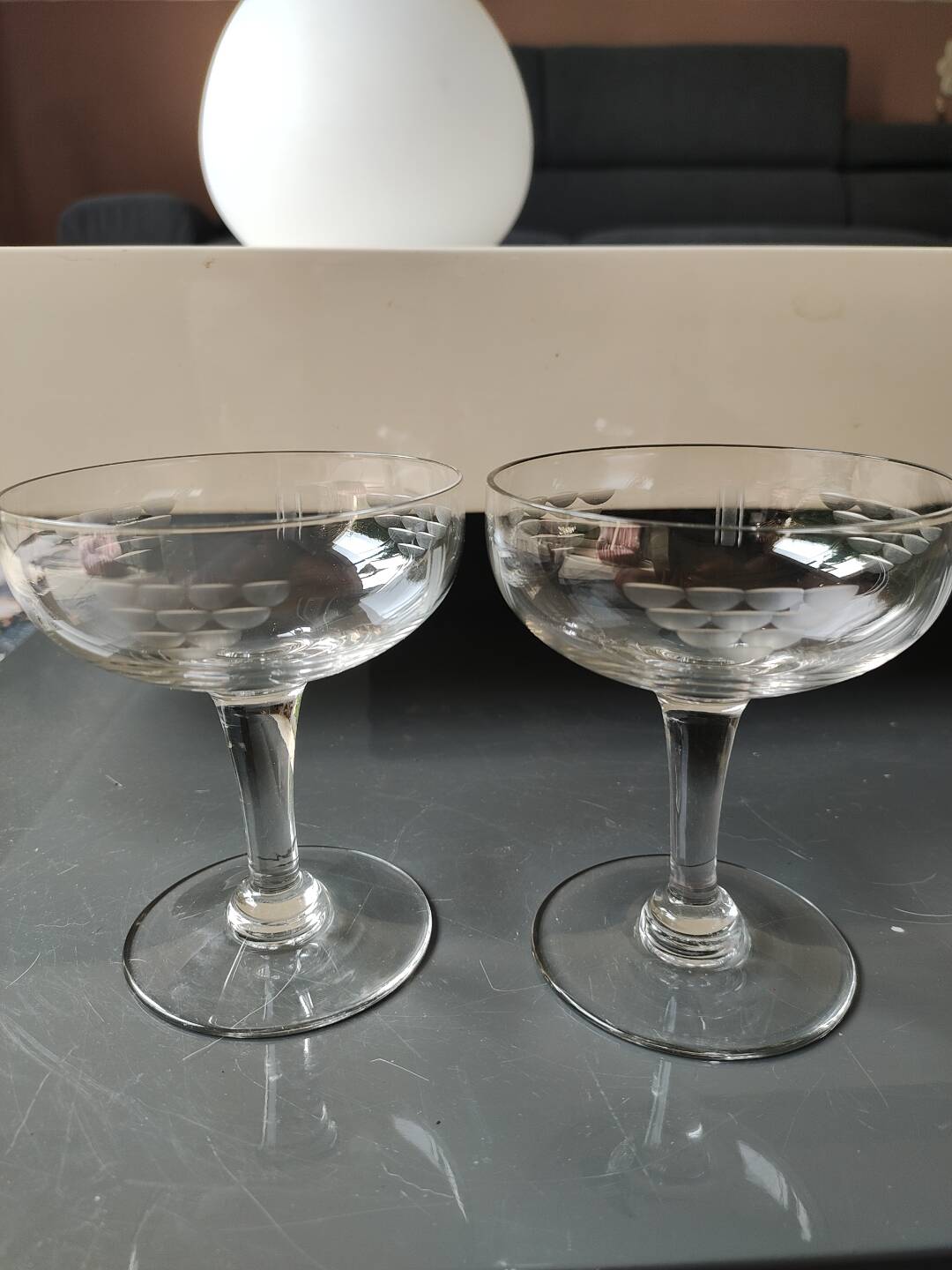 Set of 6 Baccarat-style champagne glasses. Stylized grape cluster decoration.