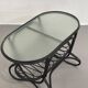 Table basse en rotin noir  et verre