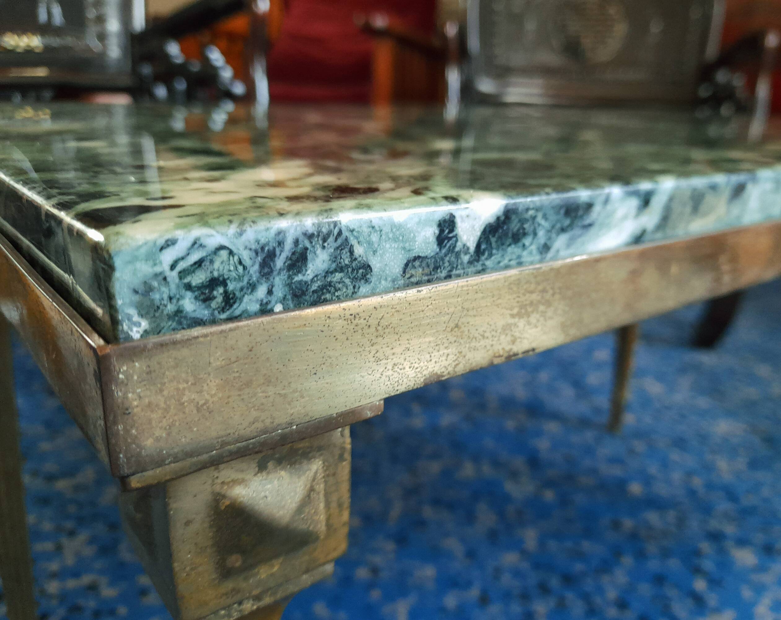 Coffee table in gilded bronze and green Alpine marble