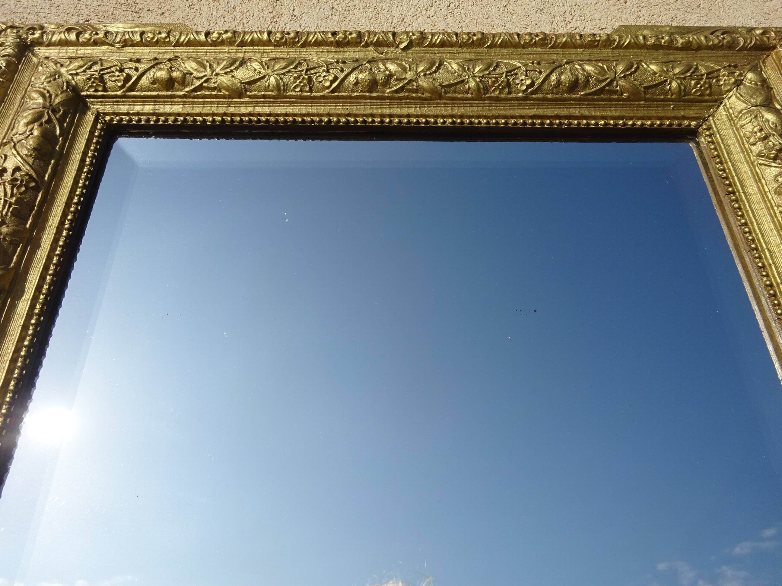 Antique mercury mirror in the Napoleon III style.