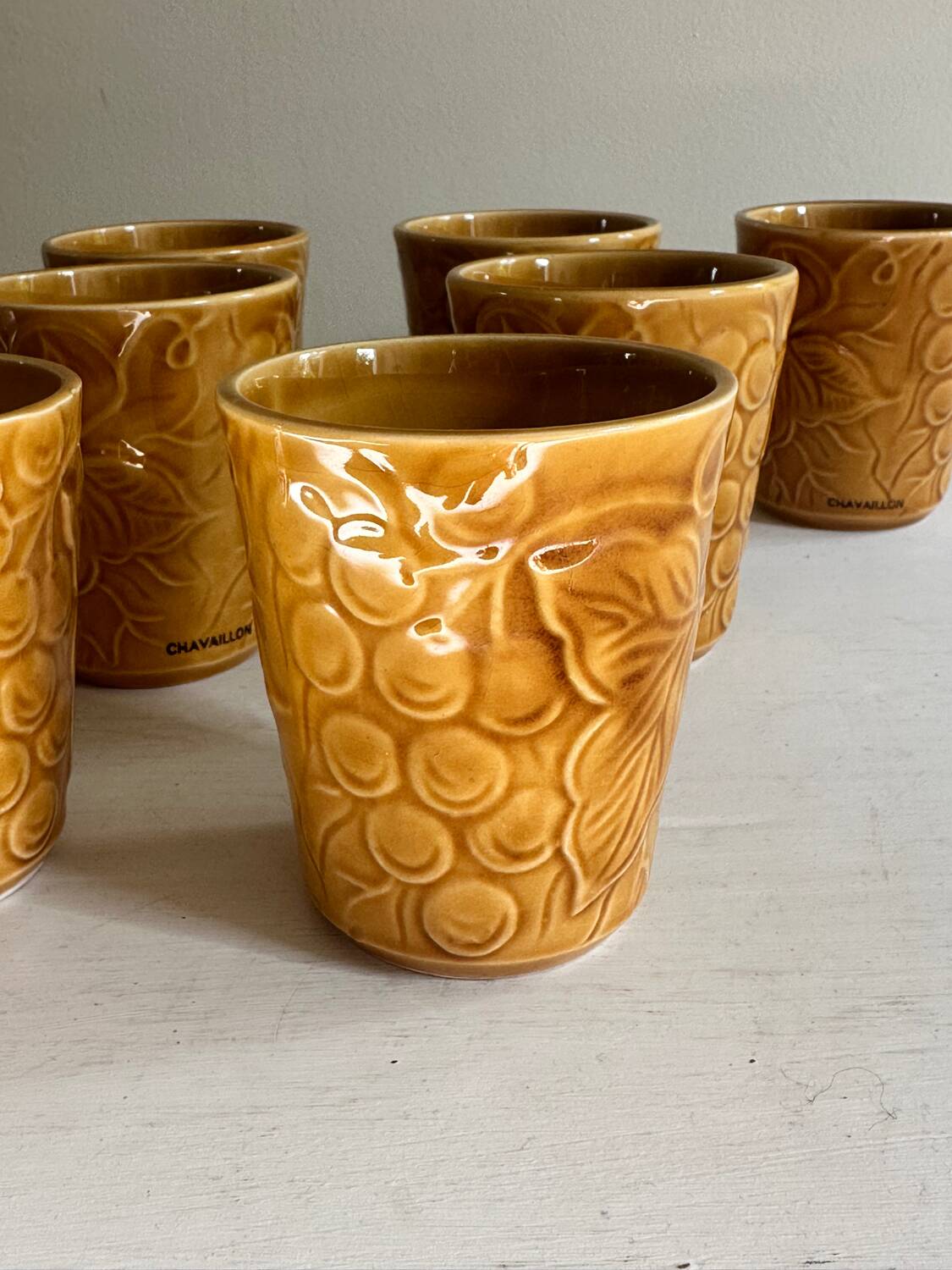 Set of 12 ochre Chavaillon de Sarreguemines cups