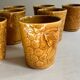 Set of 12 ochre Chavaillon de Sarreguemines cups