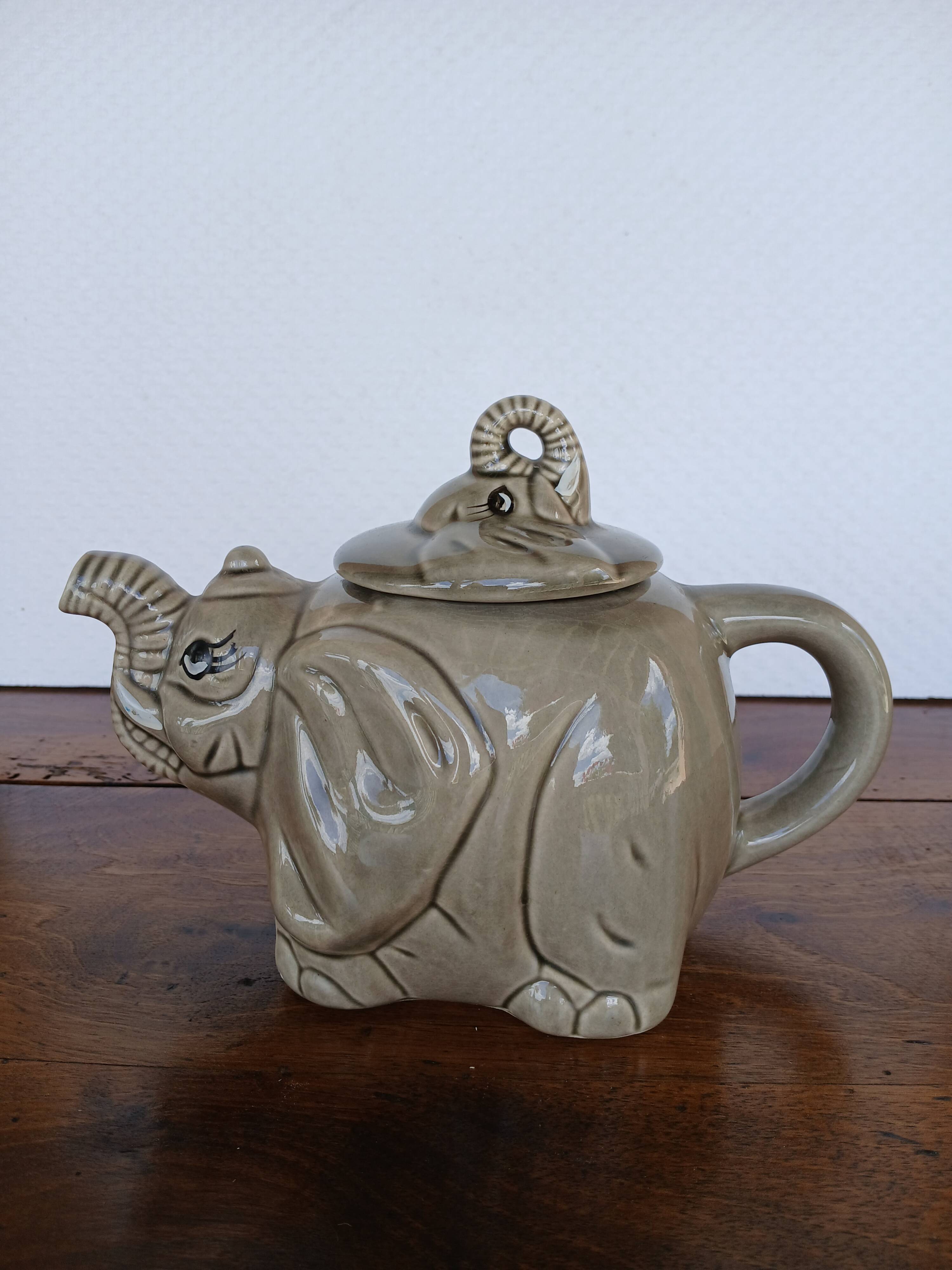 vintage ceramic teapot in the shape of a grey elephant
