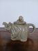 vintage ceramic teapot in the shape of a grey elephant