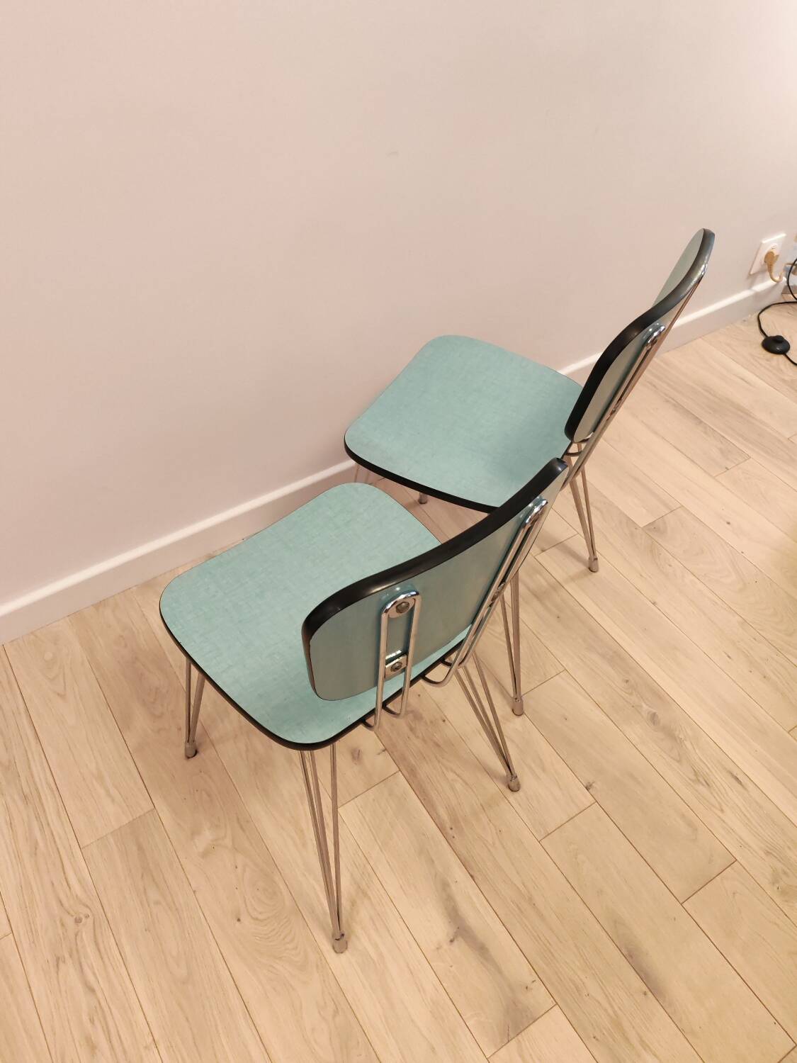 Pair of green Formica chairs with Eiffel legs
