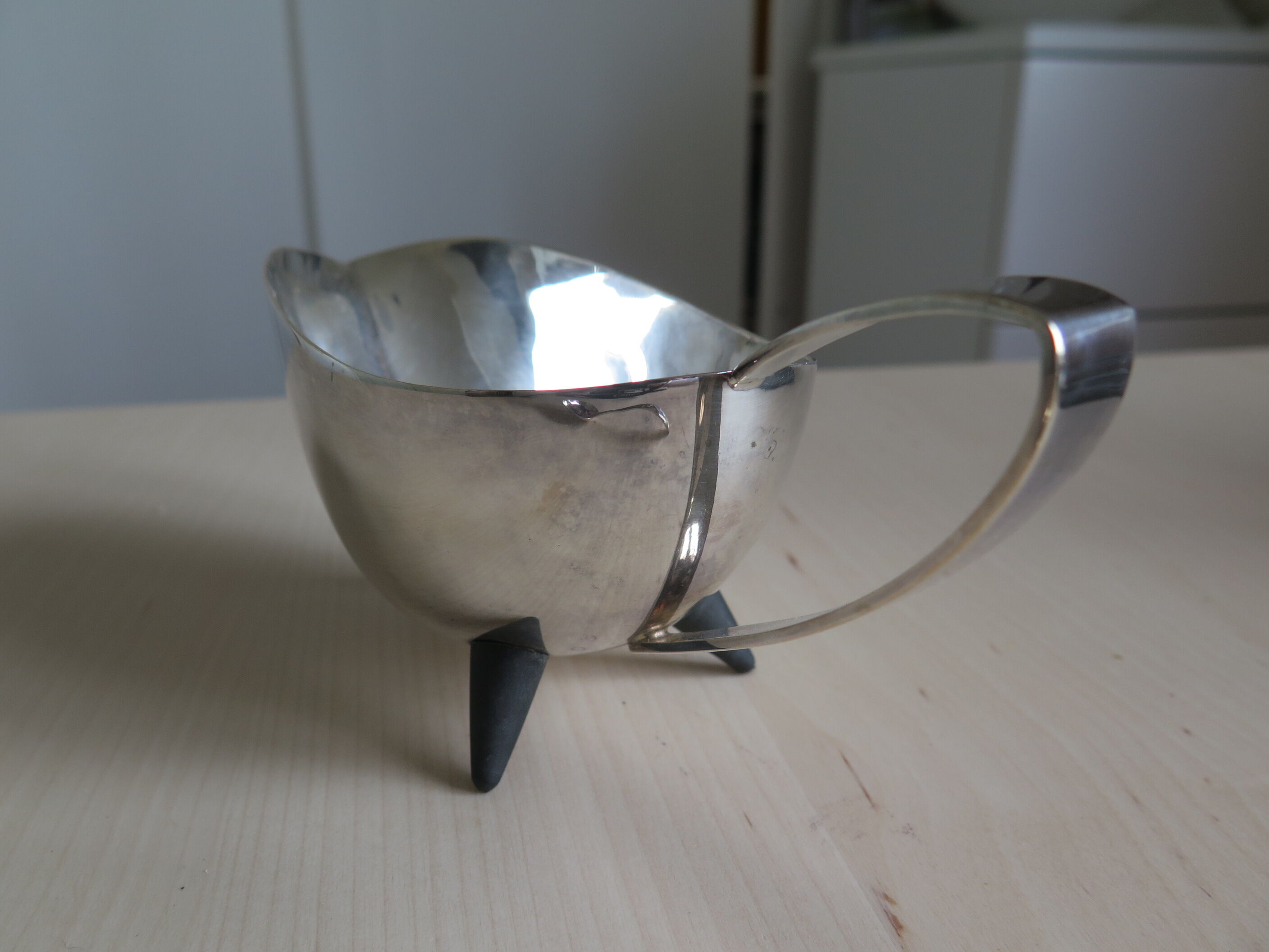 Angora tripod and silver metal spoon