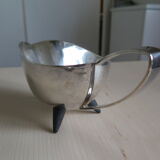 Angora tripod and silver metal spoon