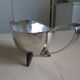 Angora tripod and silver metal spoon