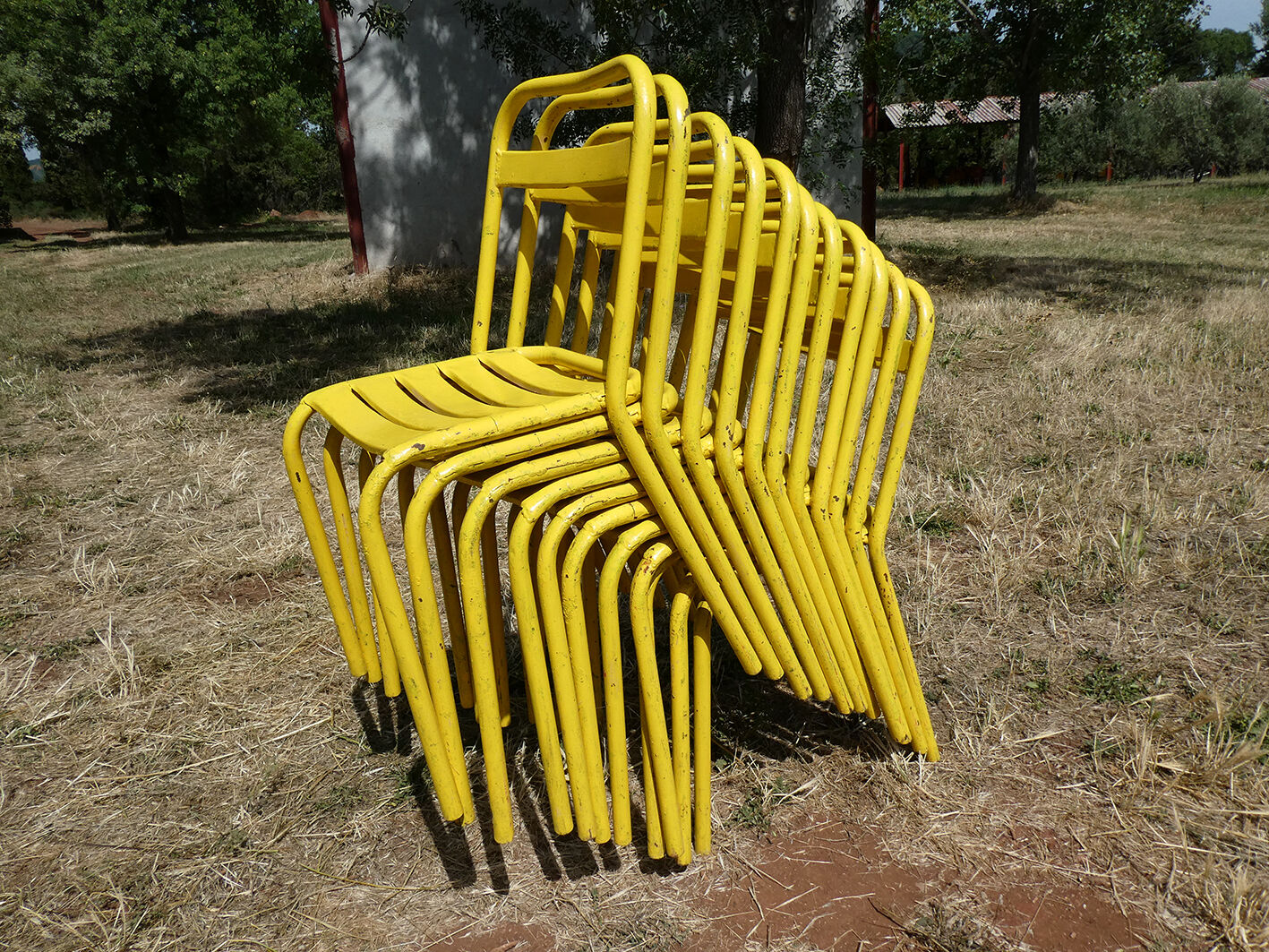 Lot of 11 yellow metallic bistro chairs from the 1950s