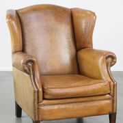 Patinated sheep leather wingback armchair