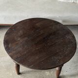 Coffee table, round antique Indonesian teak table with straight legs.