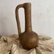 Large terracotta jug, vintage craftsmanship, wabi-sabi.