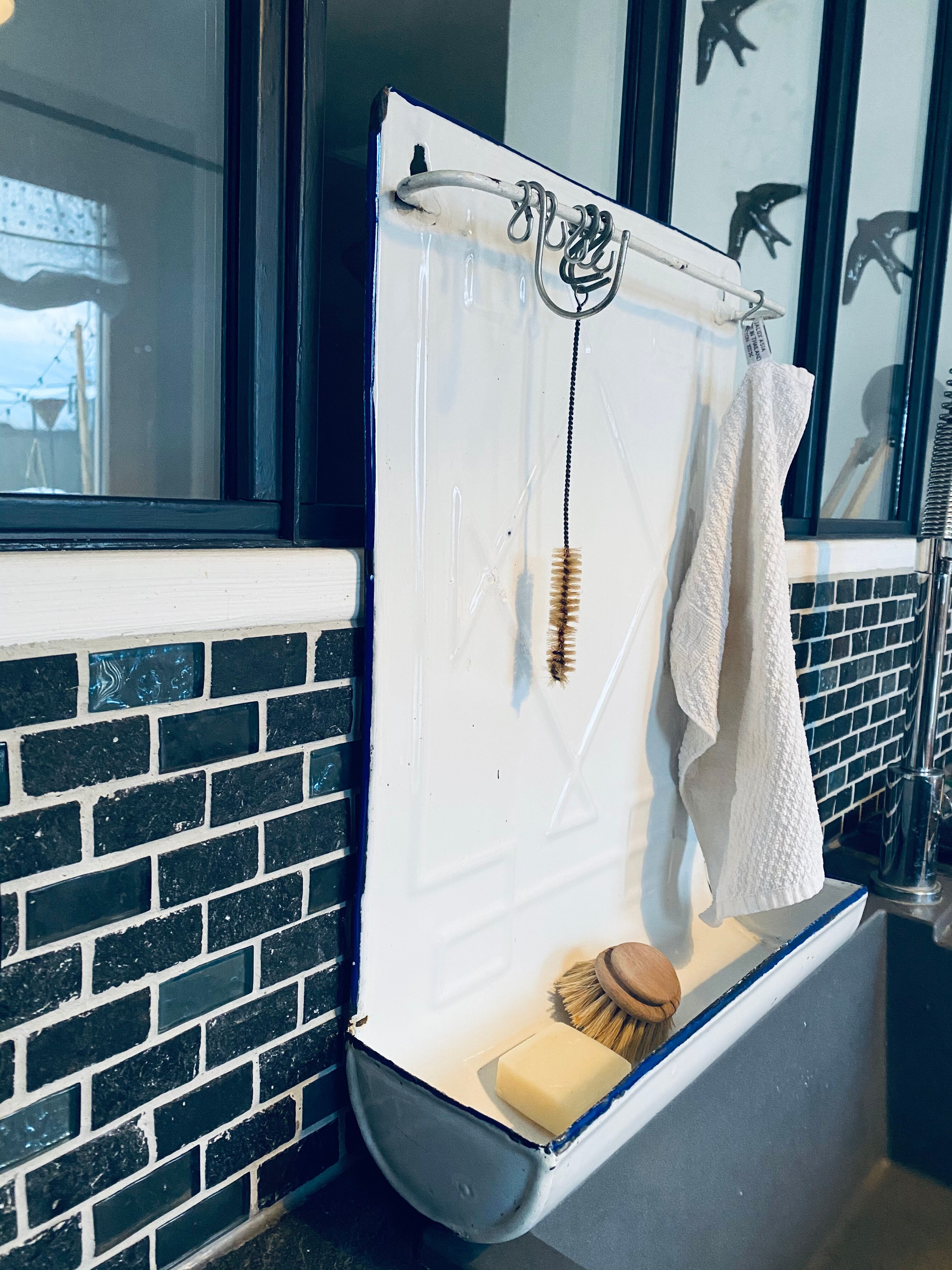 Old enamelled kitchen utensil display