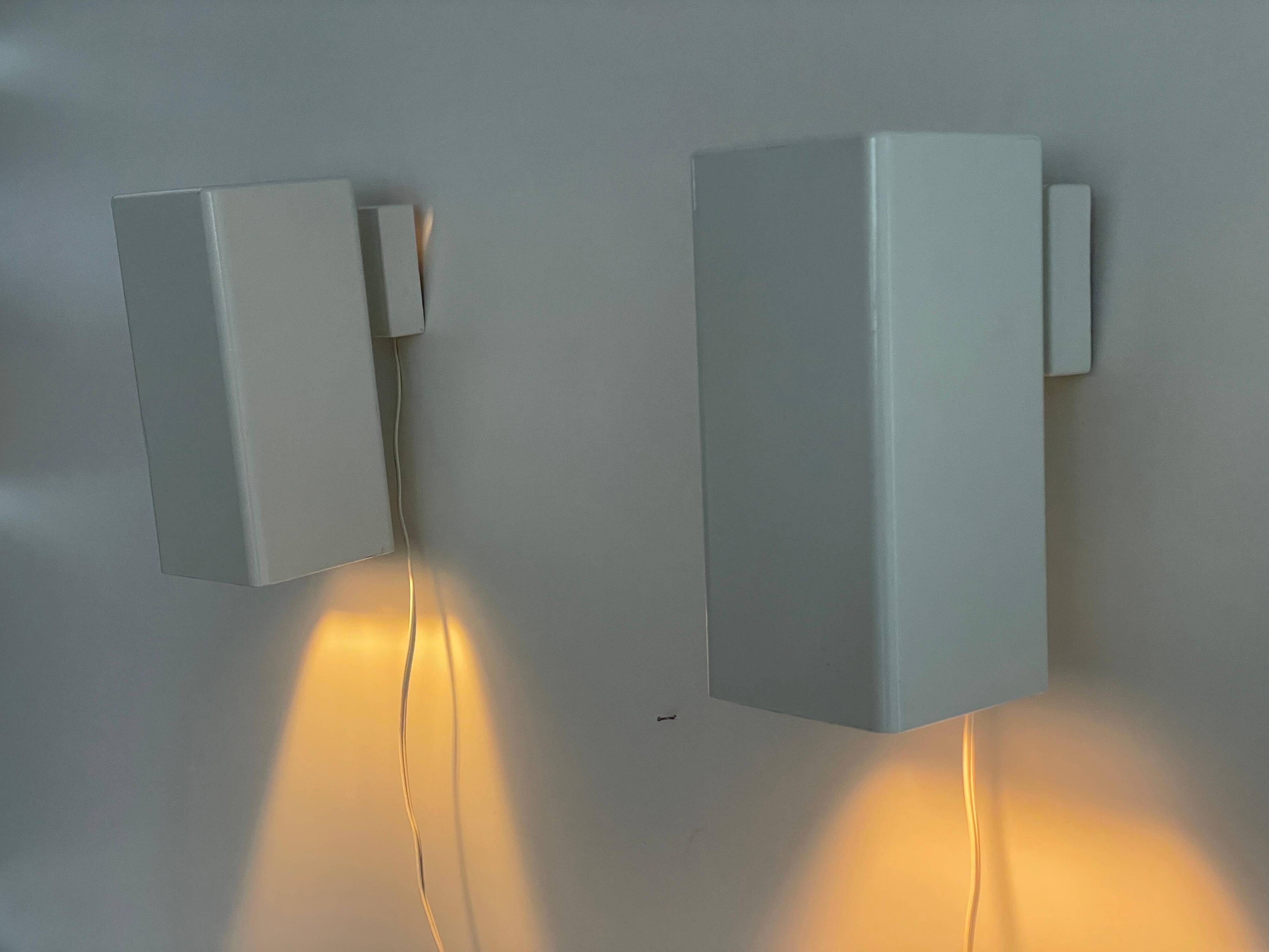 Pair of minimalist white metal wall lights from the mid-century, 1960, Germany.