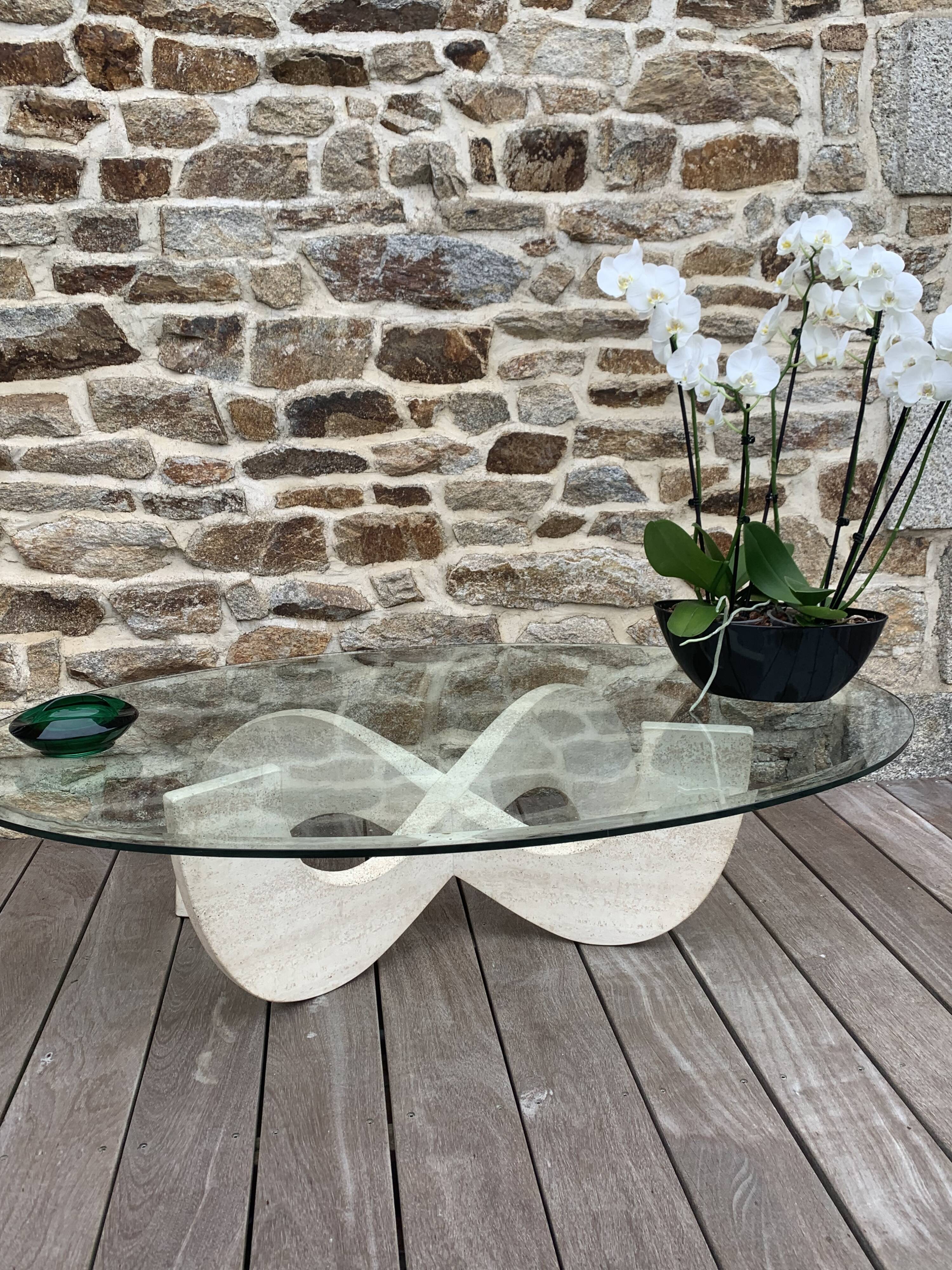 Trendy coffee table in glass and travertine