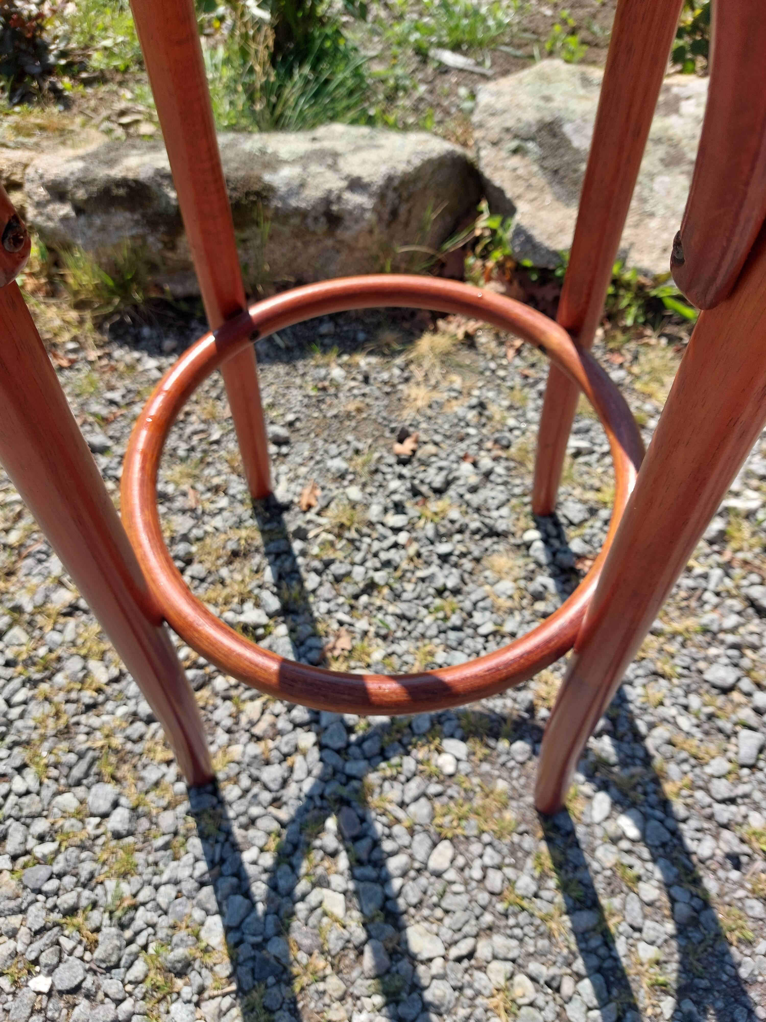 3 wooden and cane bar stools