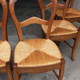 6 rustic straw chairs.