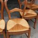 6 rustic straw chairs.