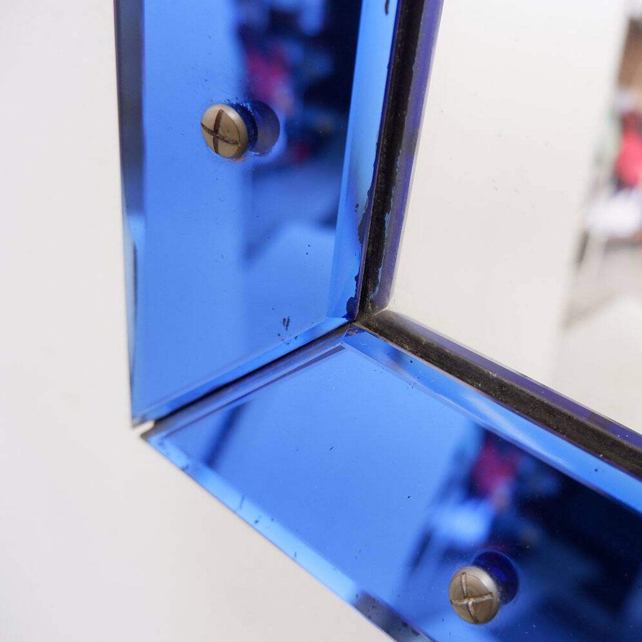 Mirror with coloured glass frame, Italy, circa 1950.