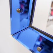 Mirror with coloured glass frame, Italy, circa 1950.