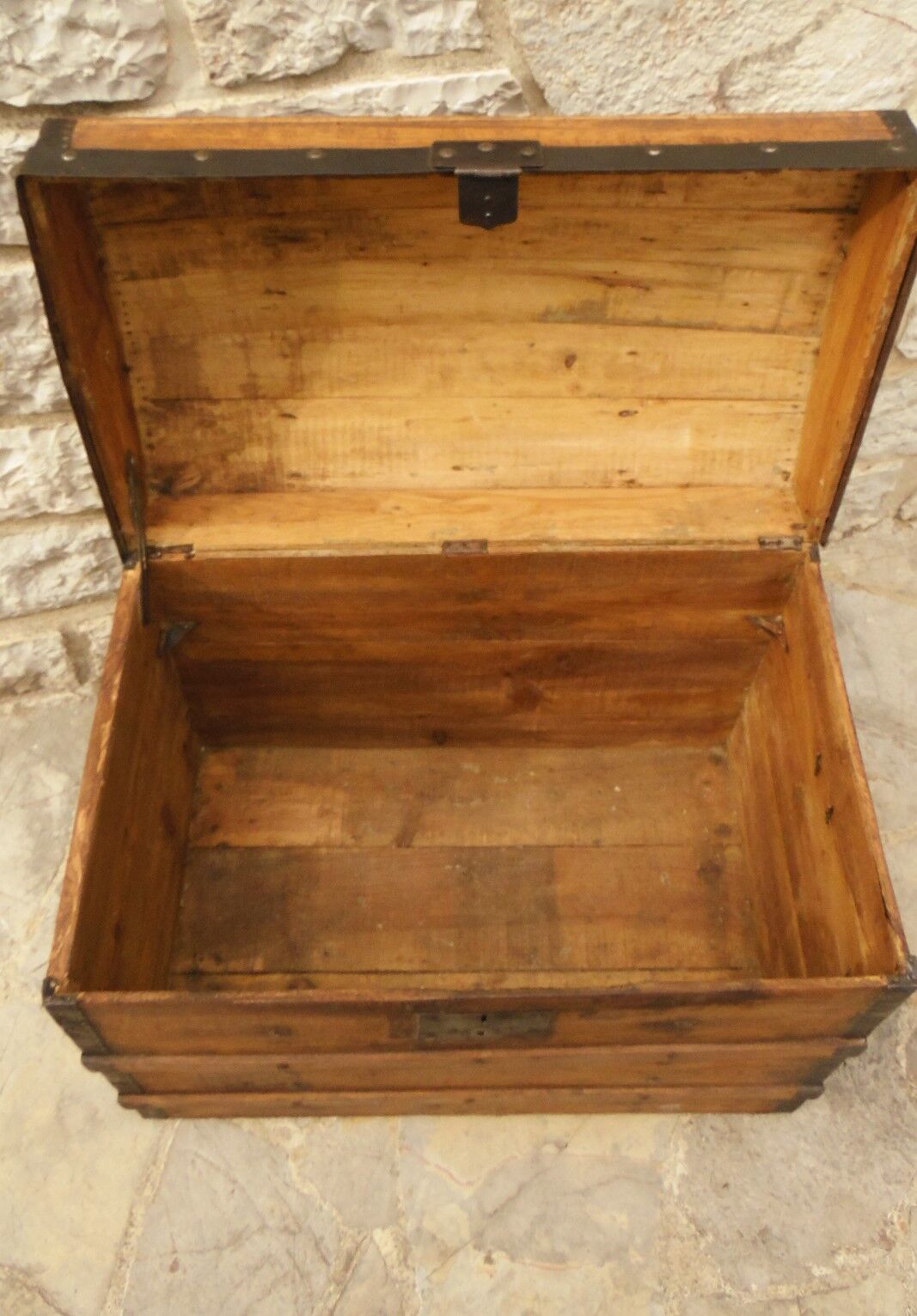 Ancient travel trunk, bulging wooden chest