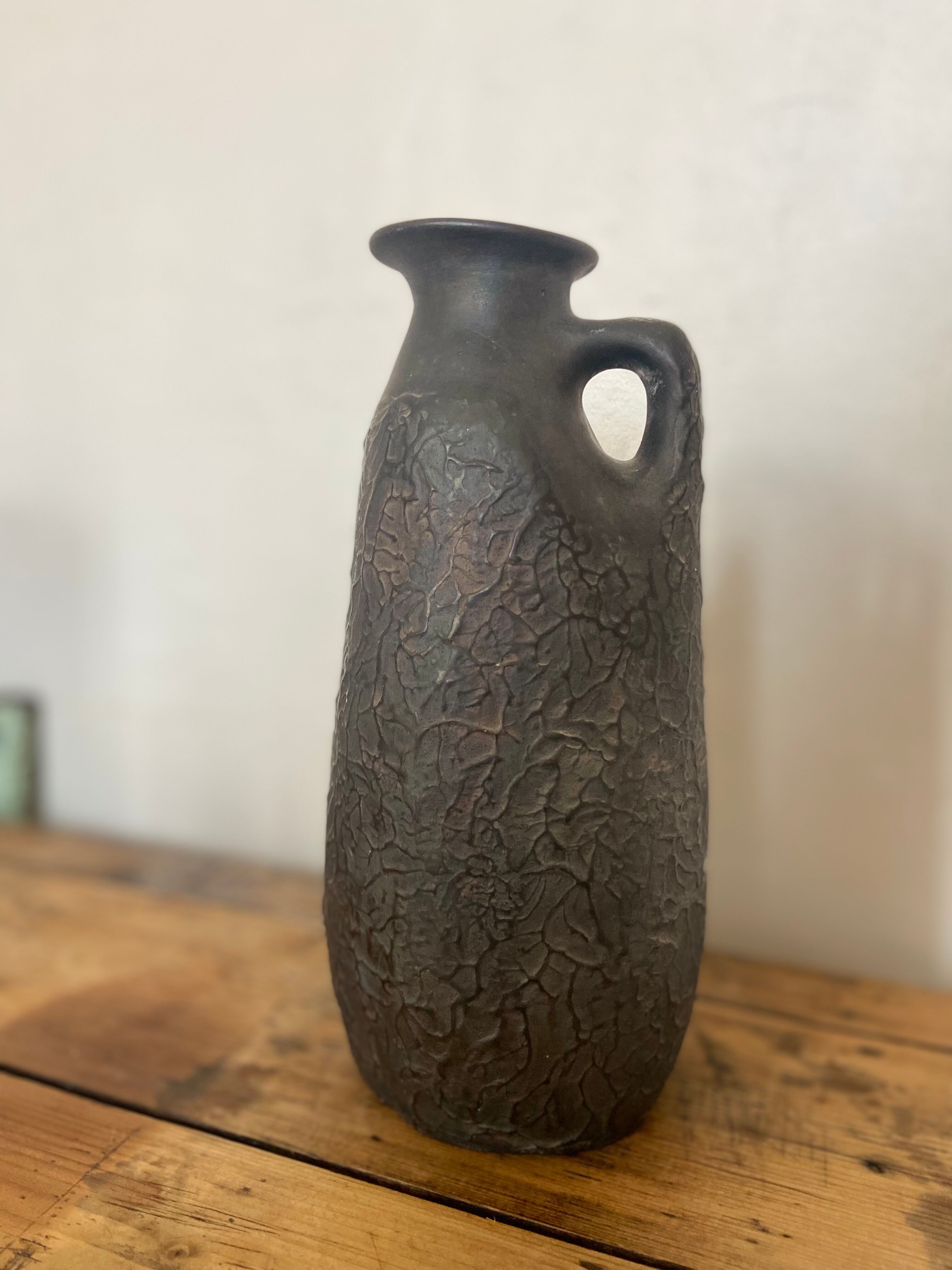 Black ceramic pitcher from the 50s