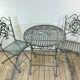Patinated green folding wrought iron garden set with 1 table + 2 chairs.