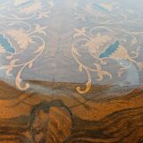 Coffee table in walnut with maple inlays and wheels