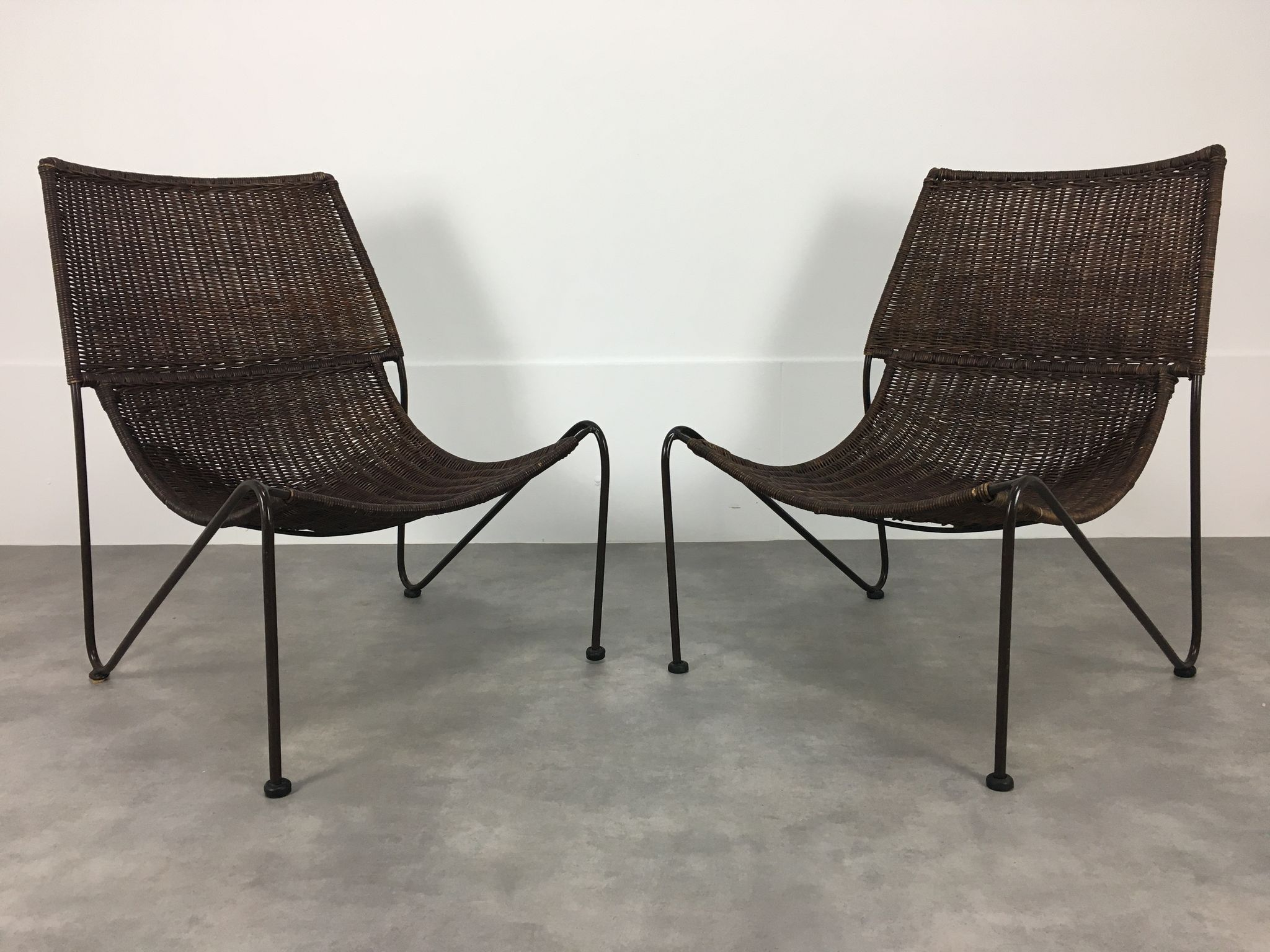 Pair of rattan and steel wire armchairs by frederick weinberg