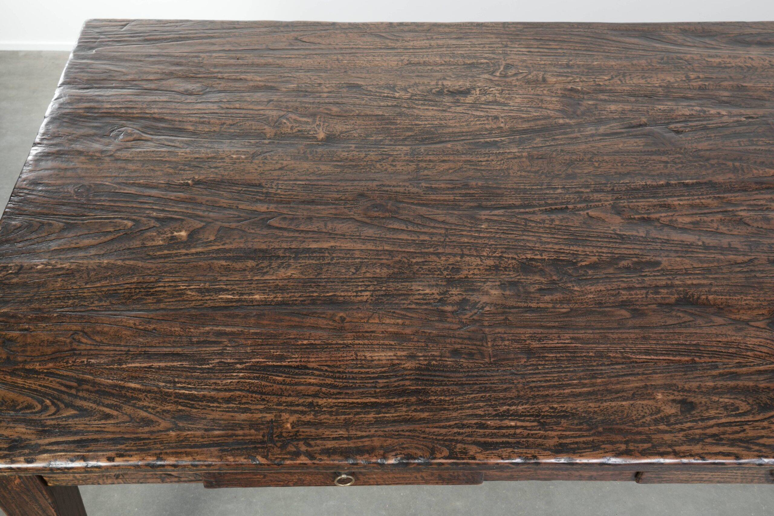 Large rustic dining table made of atmospheric elm wood with fine details