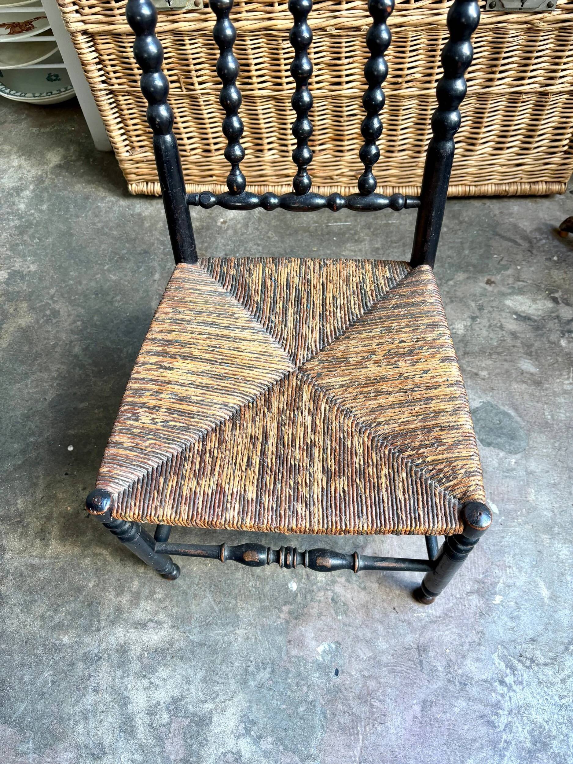 Low chair, Napoléon III child in blackened wood and woven straw.