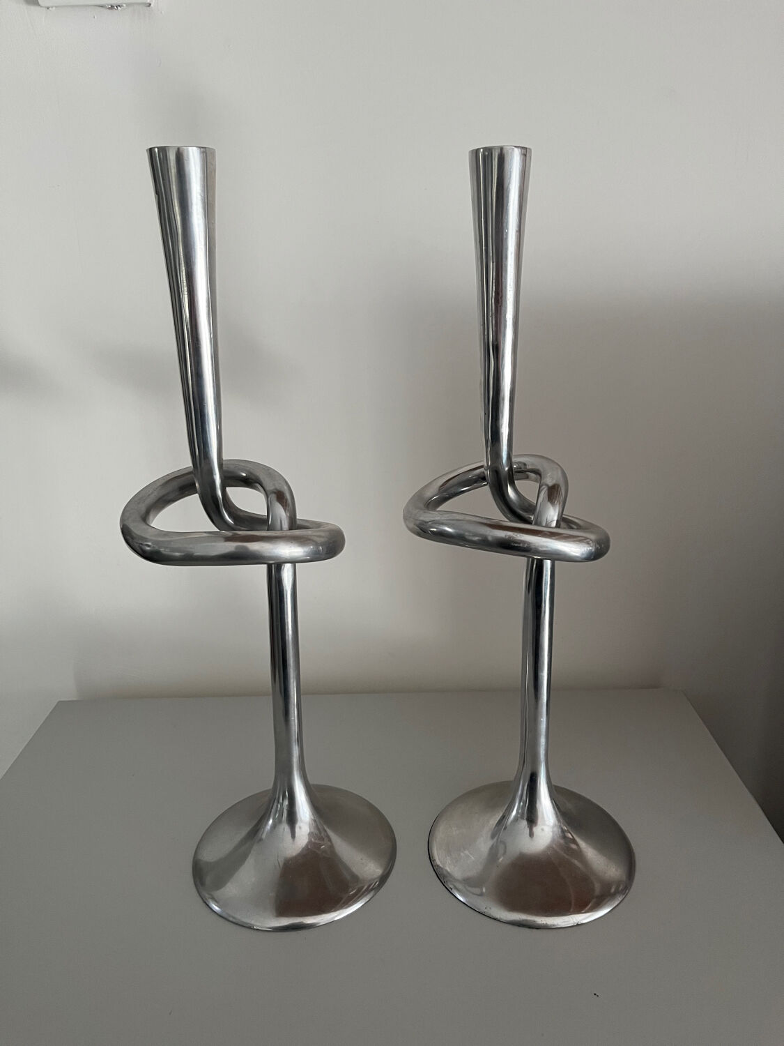 Pair of large kare design cast aluminum candlesticks