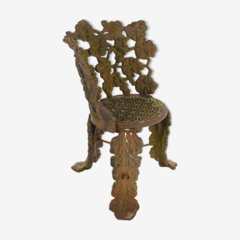 Chair with cast-iron flower decoration