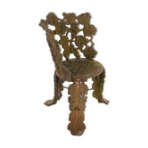 Chair with cast-iron flower decoration
