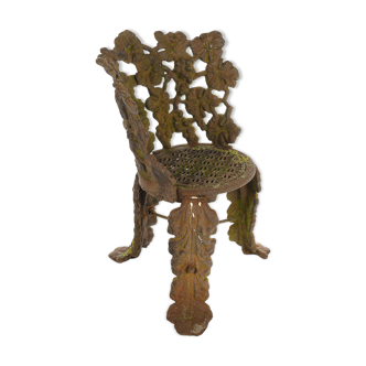 Chair with cast-iron flower decoration