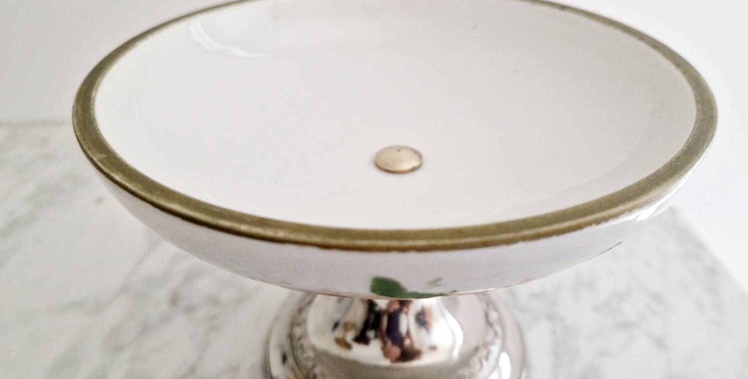 Porcelain cup on silver metal foot