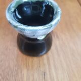 Black and green enamelled popping