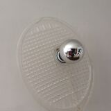 Apply tennis racket in 1980s Plexiglas
