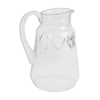 Pitcher in blown and chiseled glass