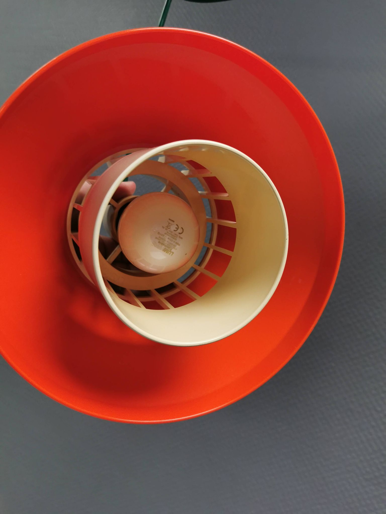 An orange pendant lamp made from hard-pressed ABS plastic. Denmark 1970s