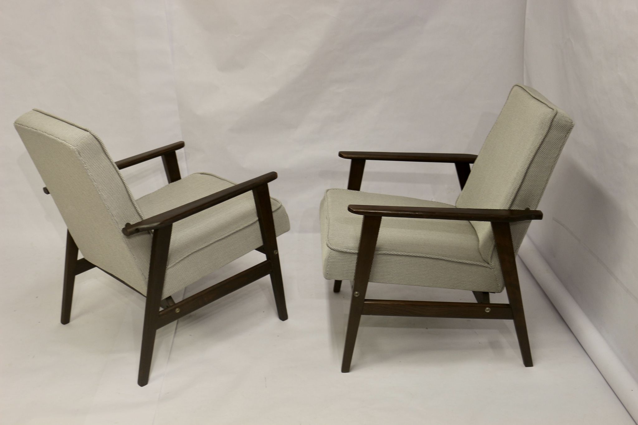 Pair of Henryk Lis armchairs 300-190s 1970s reupholstered gray textured fabric.