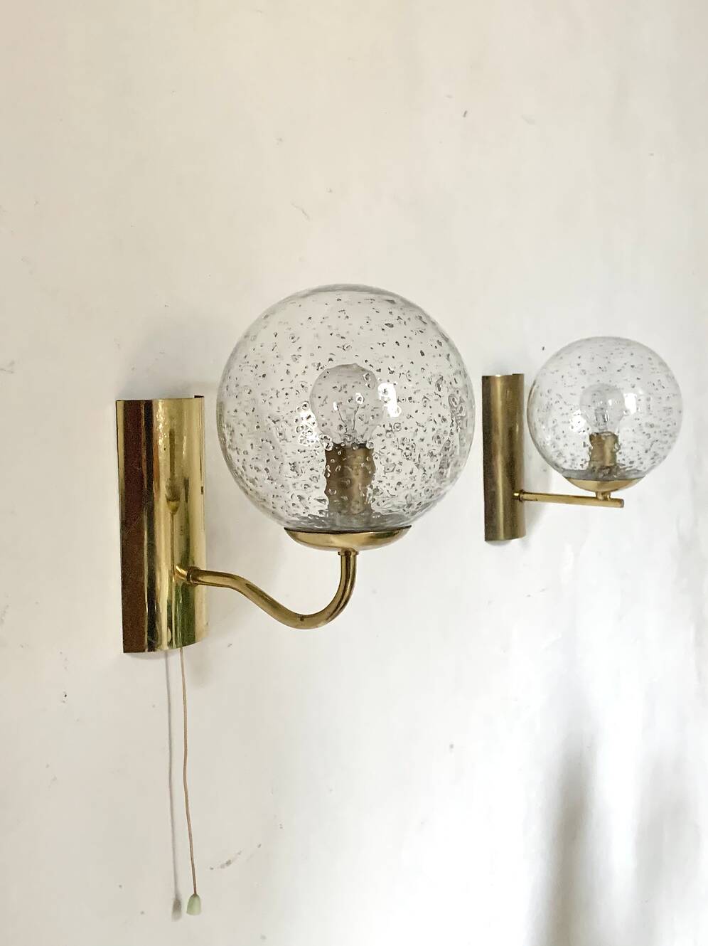 Pair of brass and glass wall sconces