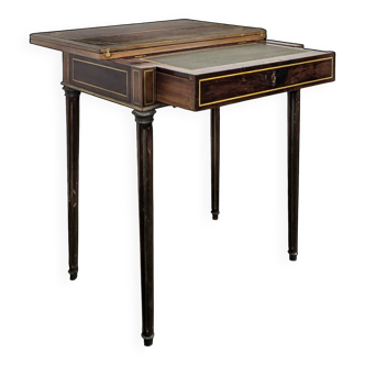 Louis XVI style mahogany game table, dressing table, and secretary.