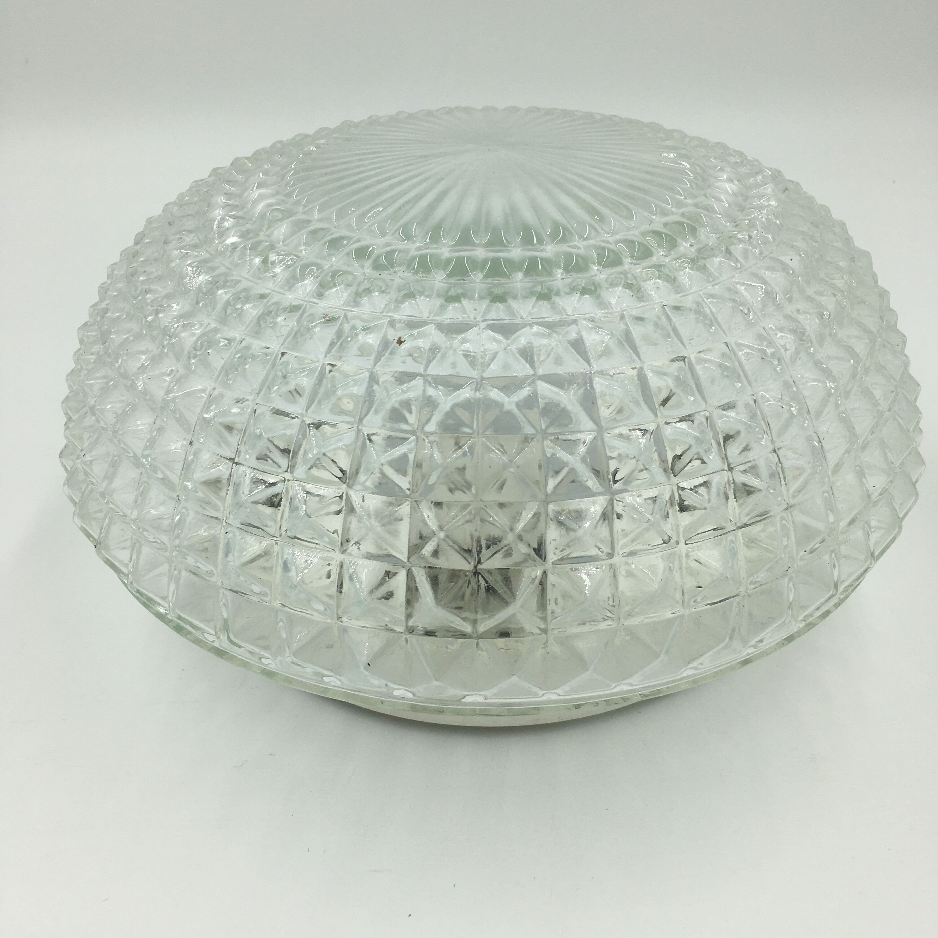Ceiling lamp in molded glass in relief