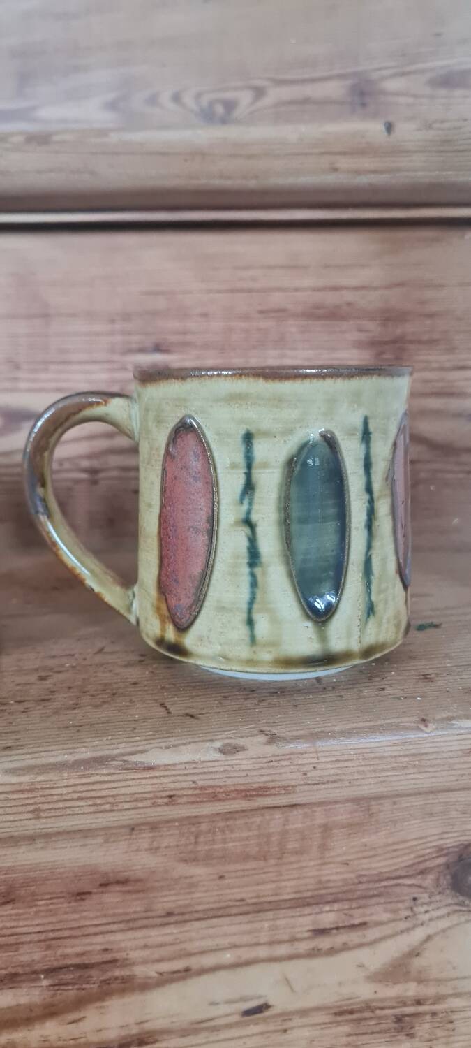 Glazed stoneware mugs from the 60s