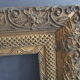 Old frame in wood and gilded stucco